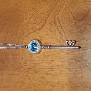 Paparazzi NWT blue gemstone key long silver necklace with earrings.